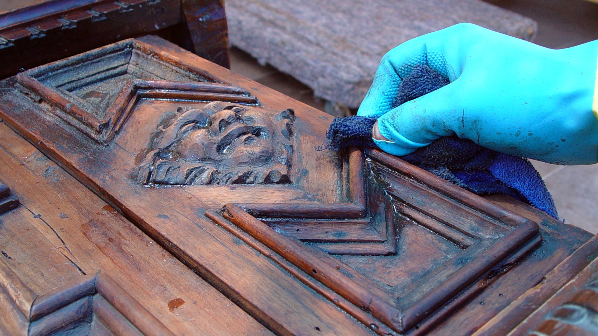 Furniture conservation - applying paint remover (stripper)