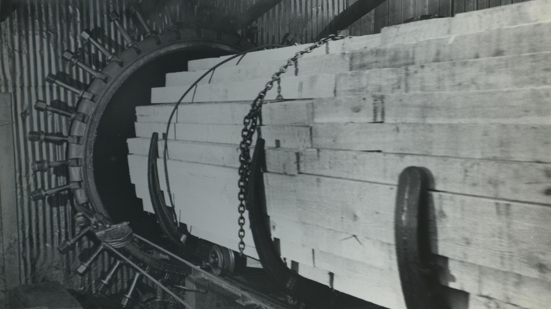 Railway sleepers entering creosote treating retort
