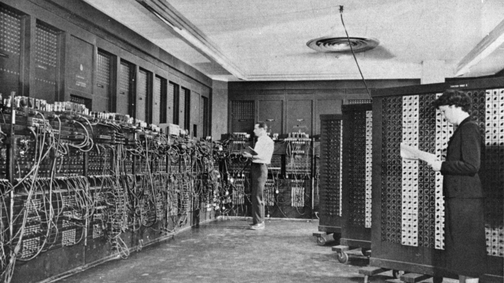 ENIAC (Electronic Numerical Integrator And Computer) in Philadelphia, Pennsylvania. Glen Beck (background) and Betty Snyder (foreground) program the ENIAC in building 328 at the Ballistic Research Laboratory (BRL).
