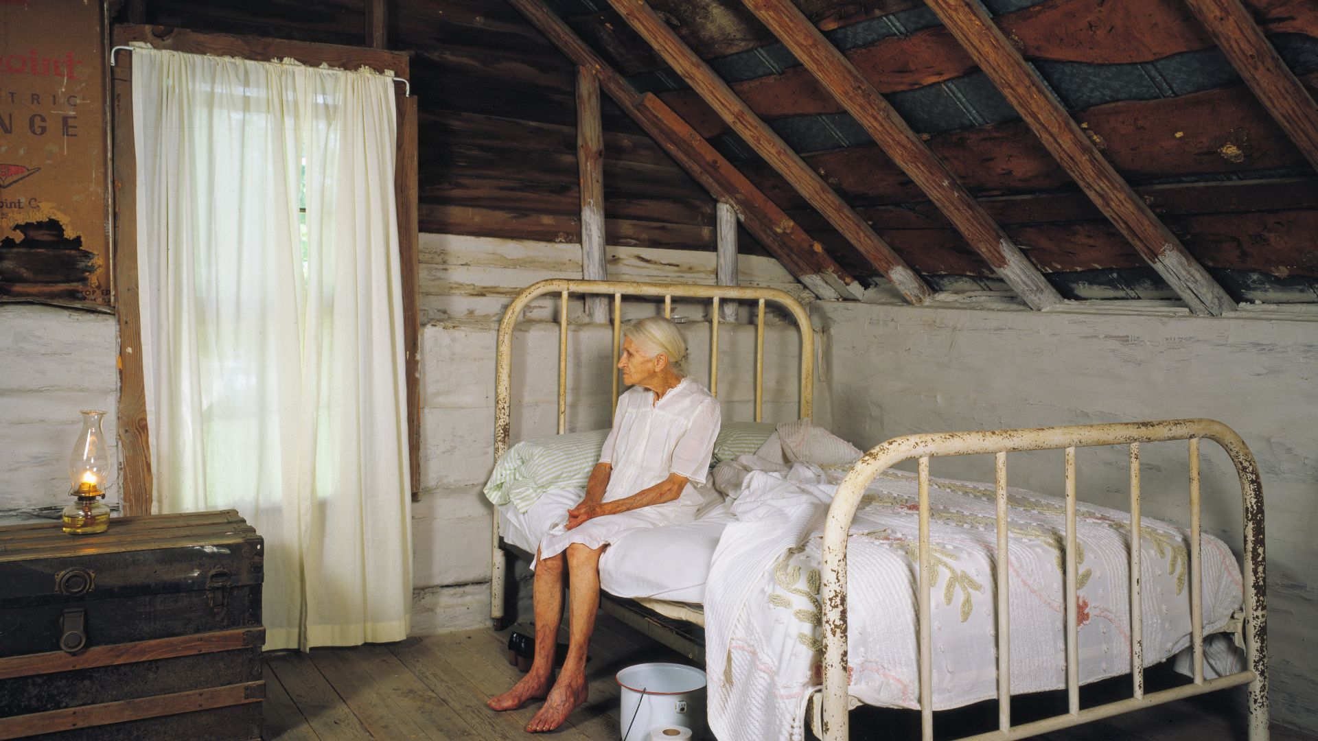 Kate Carter, on her 90th birthday, poses for photographer Carol M. Highsmith in the log cabins in North Carolina, United States, where Highsmith's great-grandfather and grandfather, Pleasant Jiles Carter (1847-1931) and Yancey Ligon Carter (1873-1947), we
