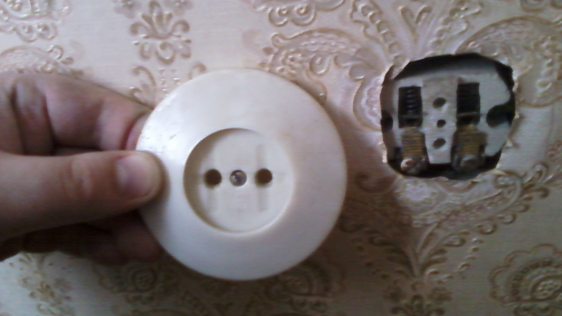 Old Soviet socket drenched by glue. As usual such installations become covered by corrosion and begin to melt when some powerful load is connected. Also, there you can find, that holes were improperly drilled to connect powerful West-European home applien