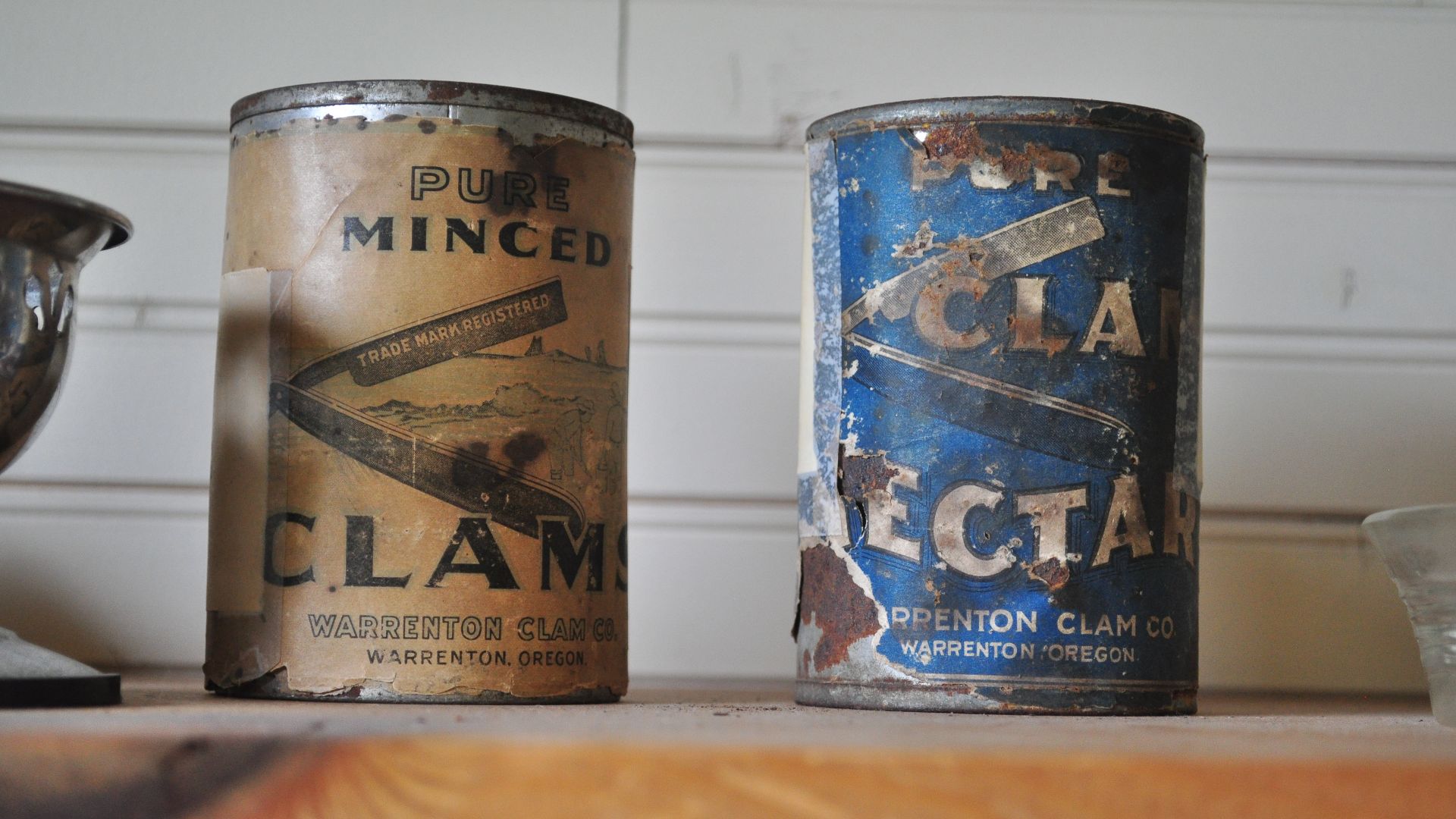 Two old cans of Warrenton Clam Company clams, Butterfield Cottage, part of the Seaside Historical Society's museum in Seaside, Oregon, U.S.