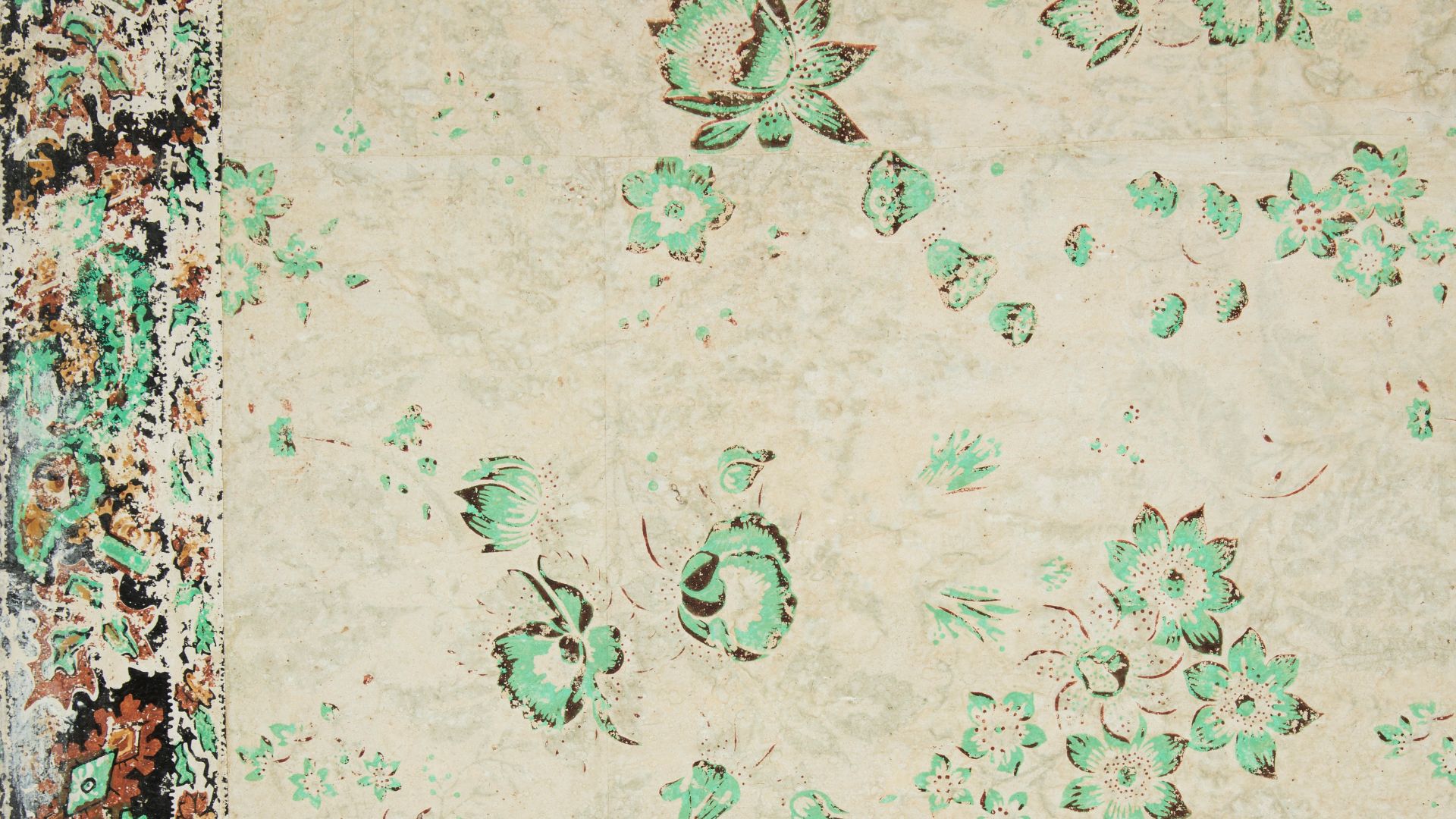 Vining floral design. Most of pattern has faded out, leaving bright green flowers. A border runs along the top edge. Green and rust-color flowers, with narrow band along both top and bottom edge of border. Border simulates applique or textile. Green color