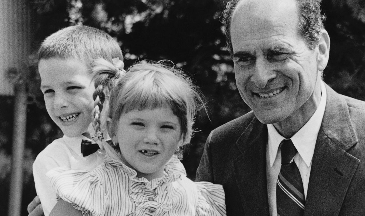 Brent Meldrum, 5, applies the Heimlich method on his sweetheart Tanya Brandon, 6, both of Lynn, showing inventor of the maneuver, Dr. Henry Heimlich, how he saved her from choking on a piece of candy last week. Believed to be the youngest person to save a life by using the method, he said he saw the Heimlich maneuver demonstrated on the television show Benson. Occasion was a heroism award for the youngster at Lynn City Hall.