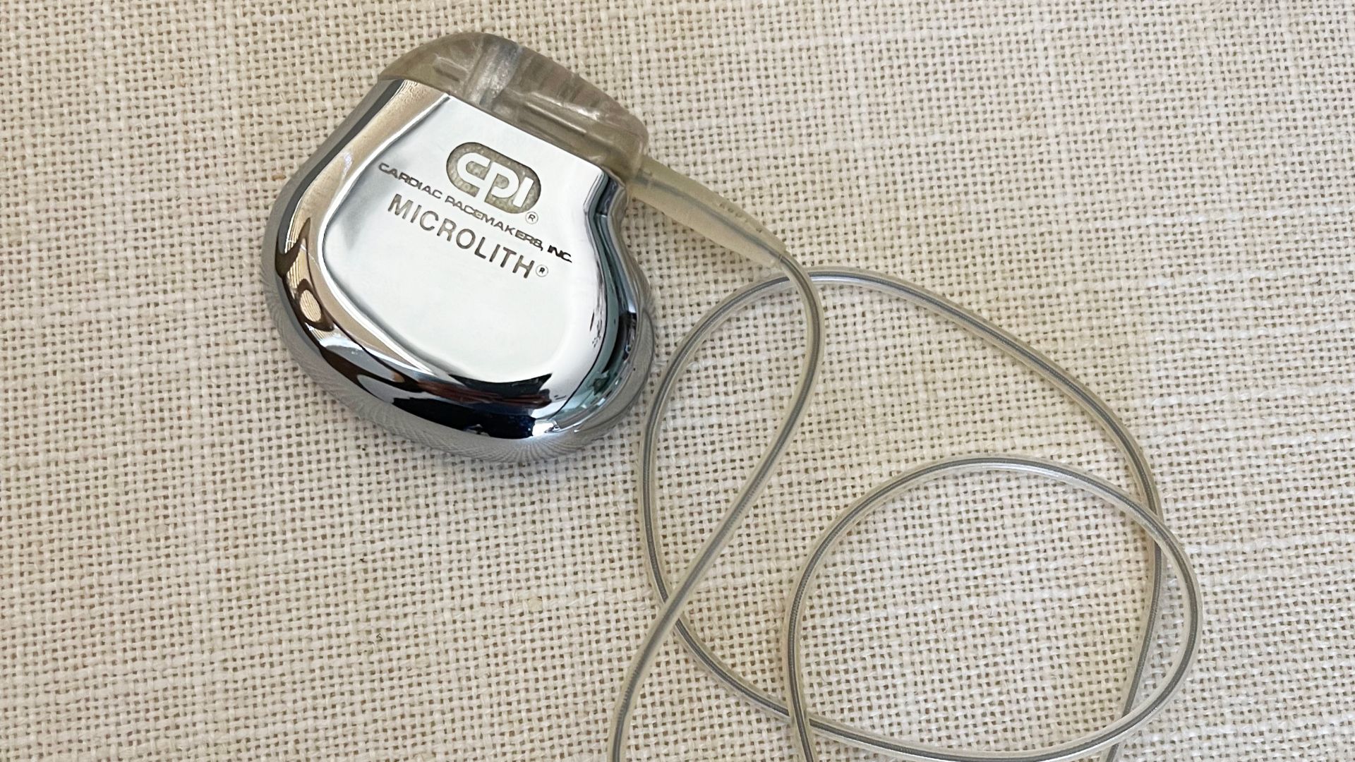 A medical device that generates electrical impulses delivered by electrodes to cause the heart muscle chambers (the upper, or atria and/or the lower, or ventricles) to contract and therefore pump blood; by doing so this device replaces and/or regulates th