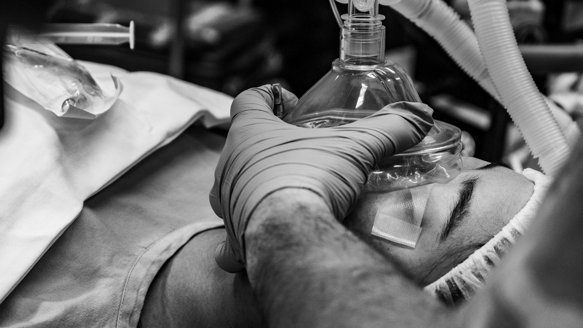 A U.S. Airman assigned to the 379th Expeditionary Medical Squadron positions anesthetic face mask to provide oxygen for a patient during anesthesia within the U.S. Central Command area of responsibility, Jan. 6, 2025. Preoxygenating the patient allows for