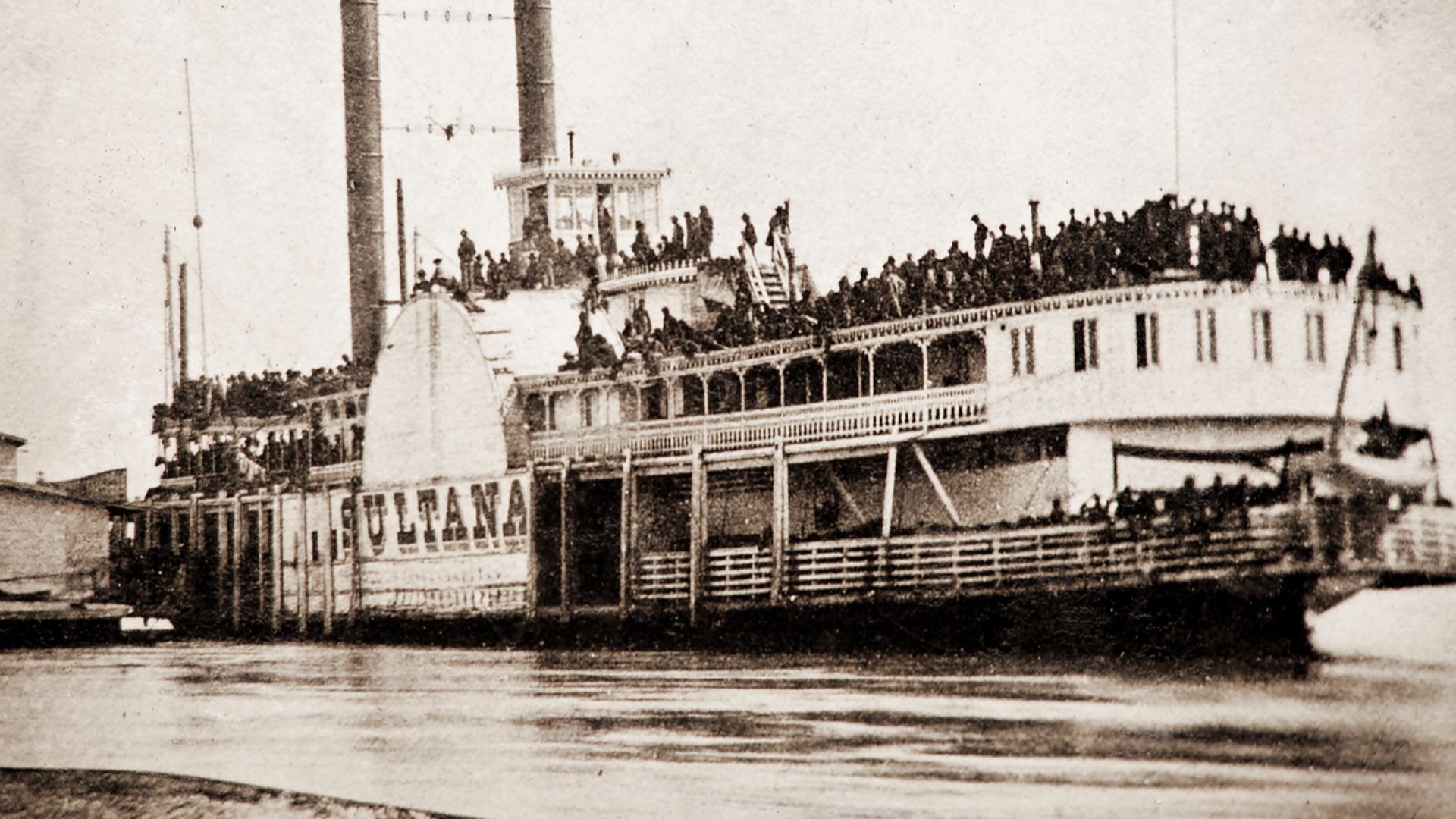 Whole plate tintype, which appears to be a period enlargement made from a carte de visite of the Sultana taken at Helena, AR, on April 26, 1865, a day before she was destroyed. The view captures a large crowd of paroled Union prisoners packed tightly toge
