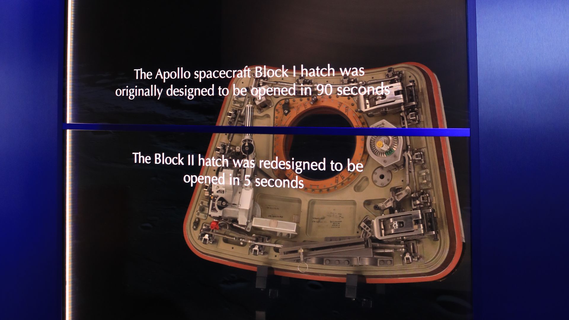 A redesigned hatch for an Apollo spacecraft is shown inside the new tribute to the crew of Apollo 1 who perished in a fire at the launch pad on Jan. 27, 1967, during training for the mission. Astronauts Gus Grissom, Ed White II and Roger Chaffee were lost