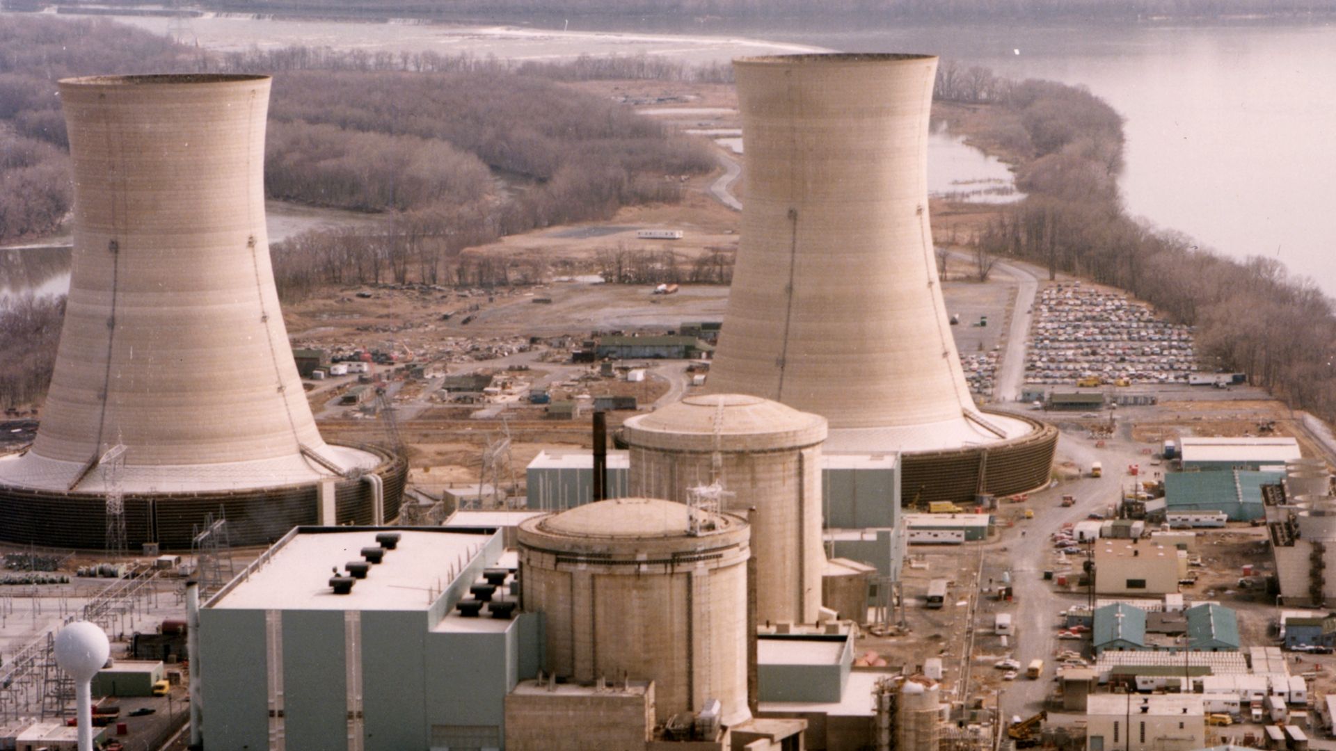 Color photograph of the Three Mile Island nuclear generating station, which suffered a partial meltdown in 1979. The reactors are in the smaller domes with rounded tops (the large smokestacks are just cooling towers).