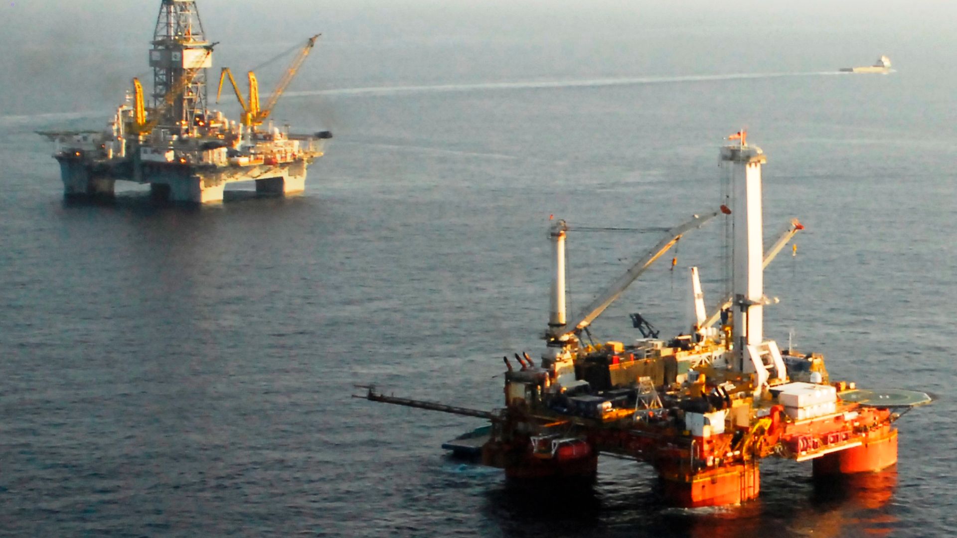 Rigs drilling a relief well and preparing the static kill are shown in the Gulf of Mexico July 31st, 2010, over the Deepwater Horizon well 40 miles from the southern coast of Louisiana.