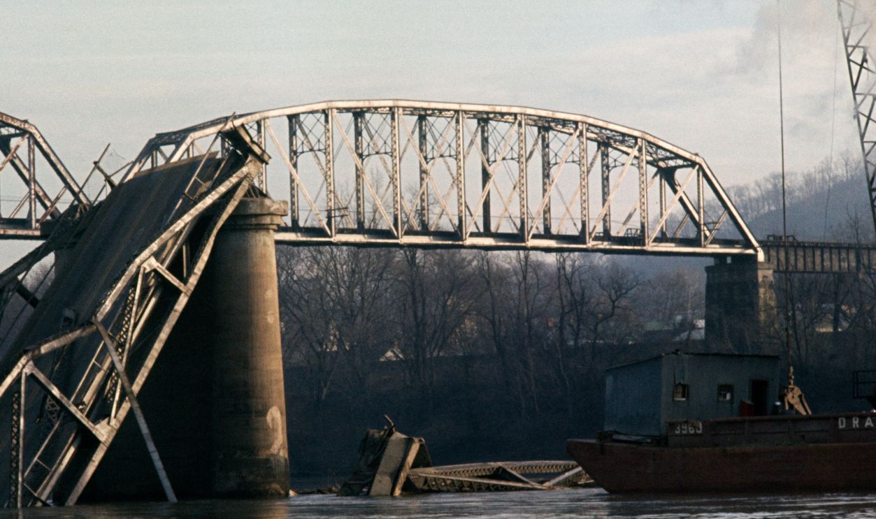 The wrecked Silver Bridge, spanning the Ohio River between Ohio and West Virginia, pictured after its collapse during rush hour traffic, December 17th 1967.