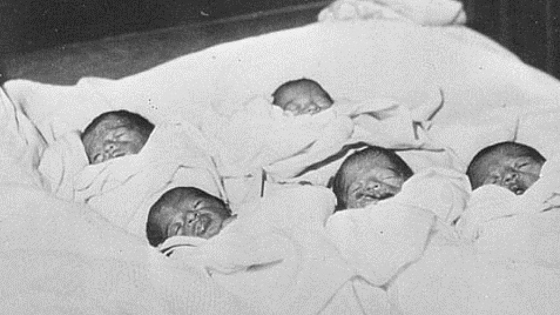 Dionne quintuplets with their mother.