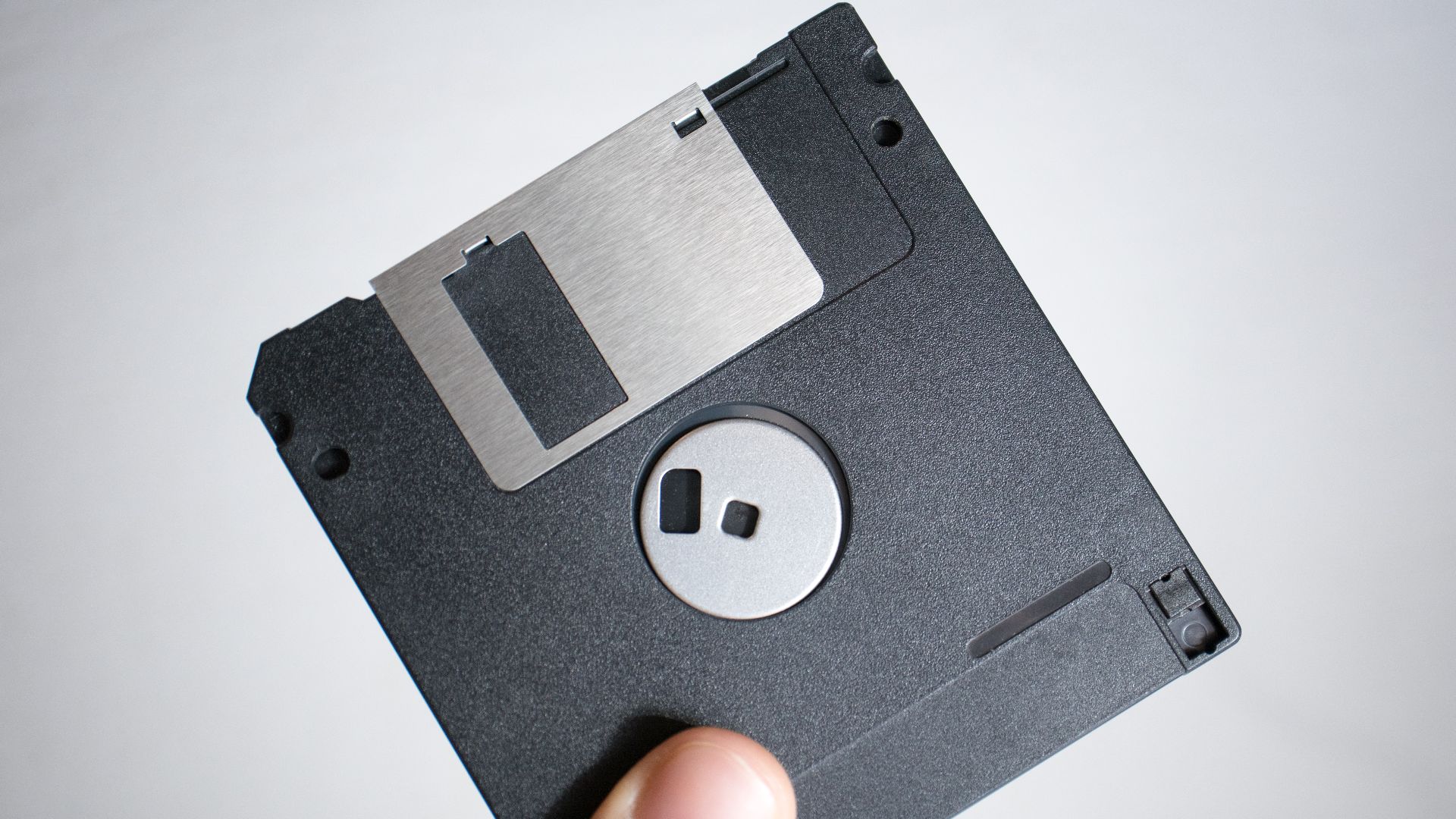 Hand with floppy disk
