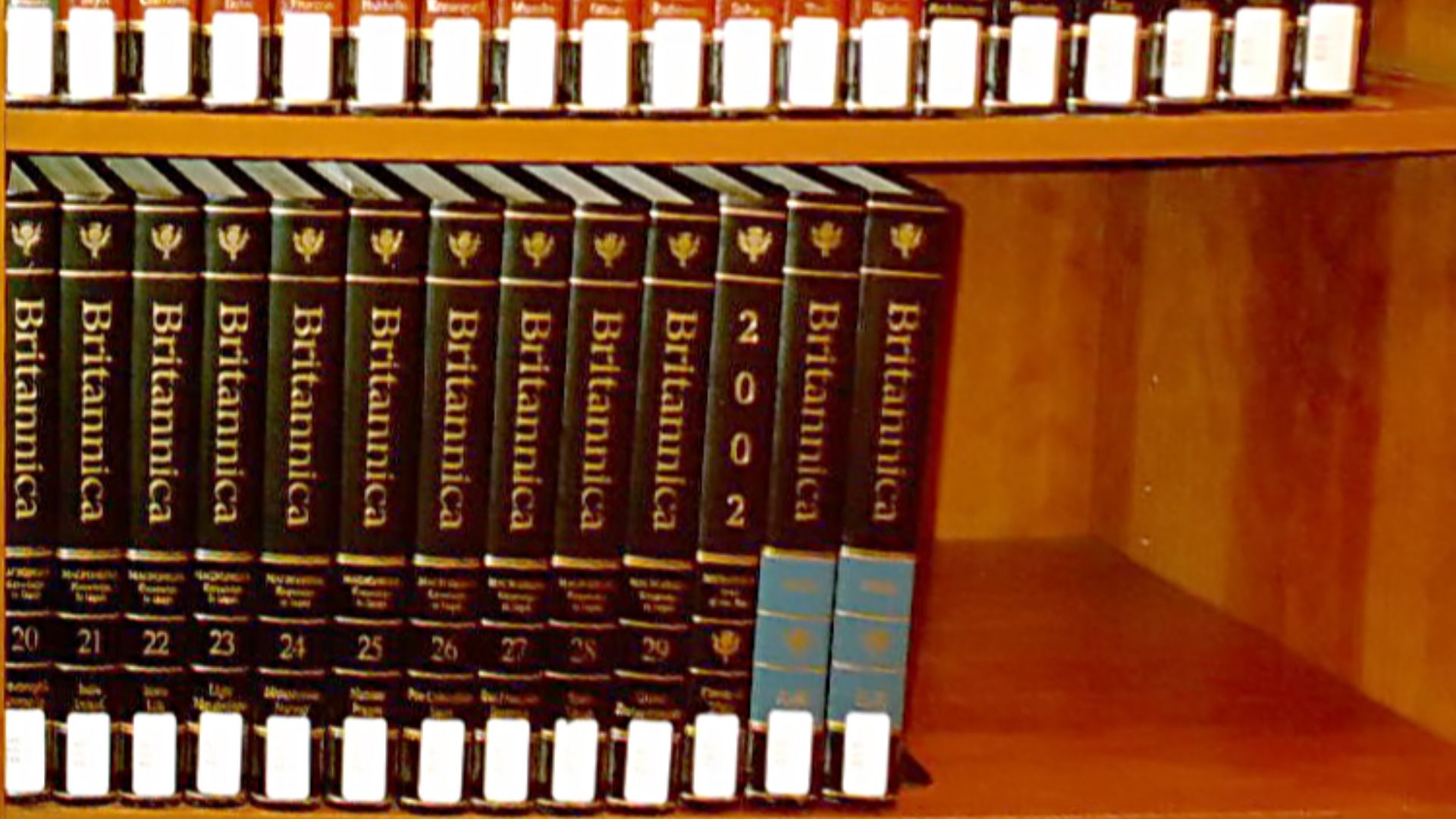 Encyclopaedia Britannica, 15th edition, with Britannica book of the year 2002, with white library labels.