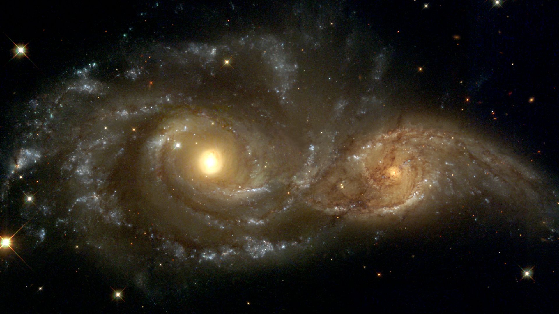 Near colliding NGC 2207 and IC 2163 as seen by the NASA/ESA Hubble Space Telescope.