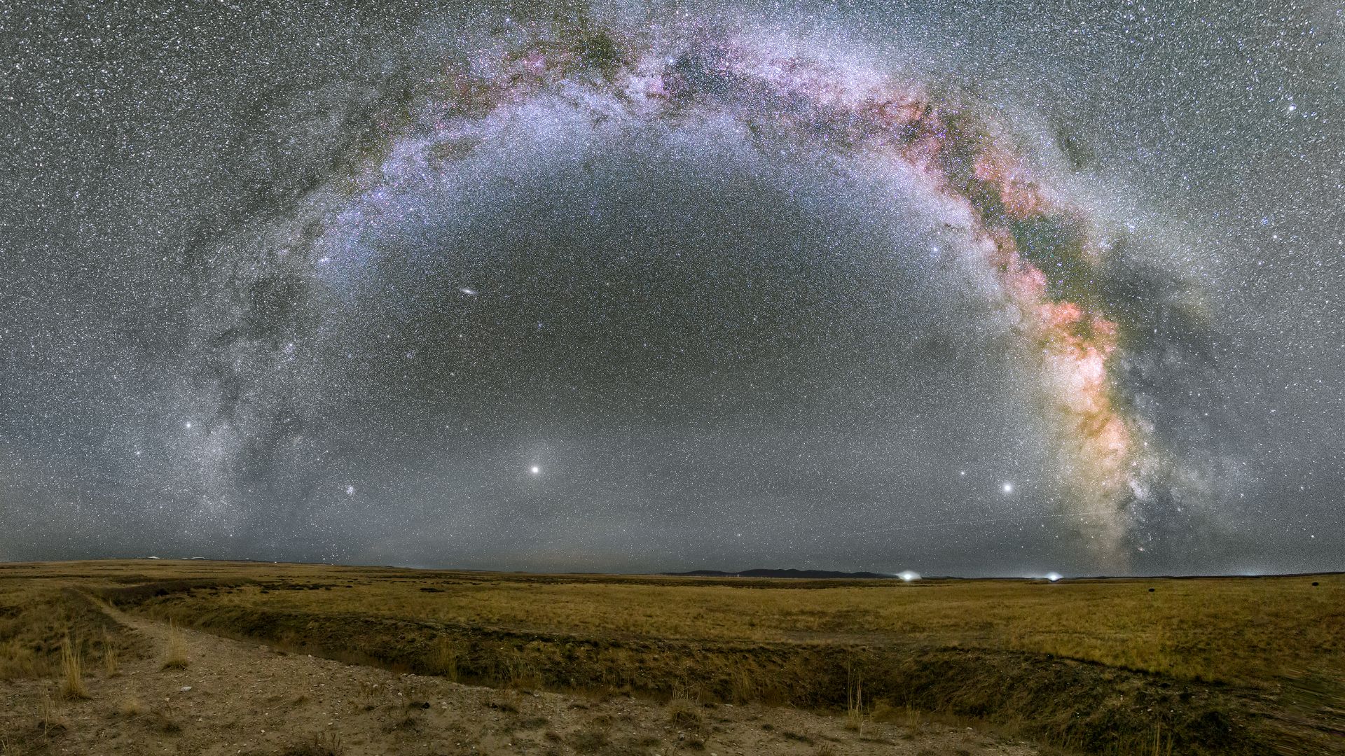 Scientific Description: The Celestial Arch Over the Aktau Fortress

This comprehensive astrophotographic panorama captures a breathtaking view of the Milky Way galaxy arching over the Karaganda steppe in Kazakhstan. By blending historical terrestrial land