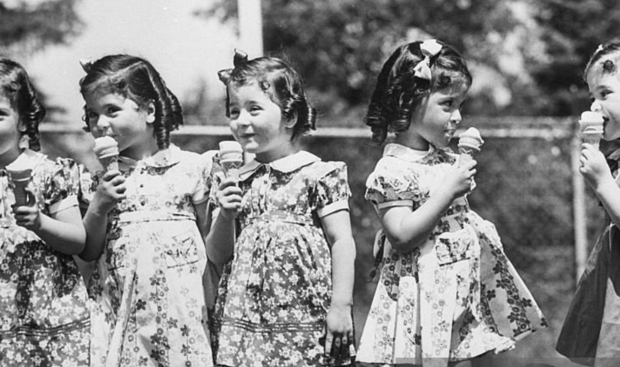 (Original Caption) 5/28/1938- Callender, Ontario- On their fourth birthday, the fast-growing quintuplets received ice cream cones as a special added treat. Left to right: Emilie, Annette, Marie, Cecile and Yvonne.