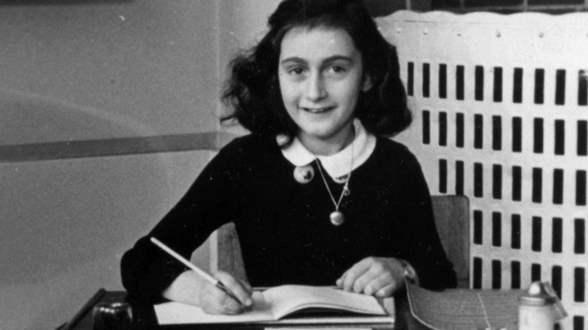 Anne Frank in 1940, while at 6. Montessorischool, Niersstraat 41-43, Amsterdam (the Netherlands). Photograph by unknown photographer.