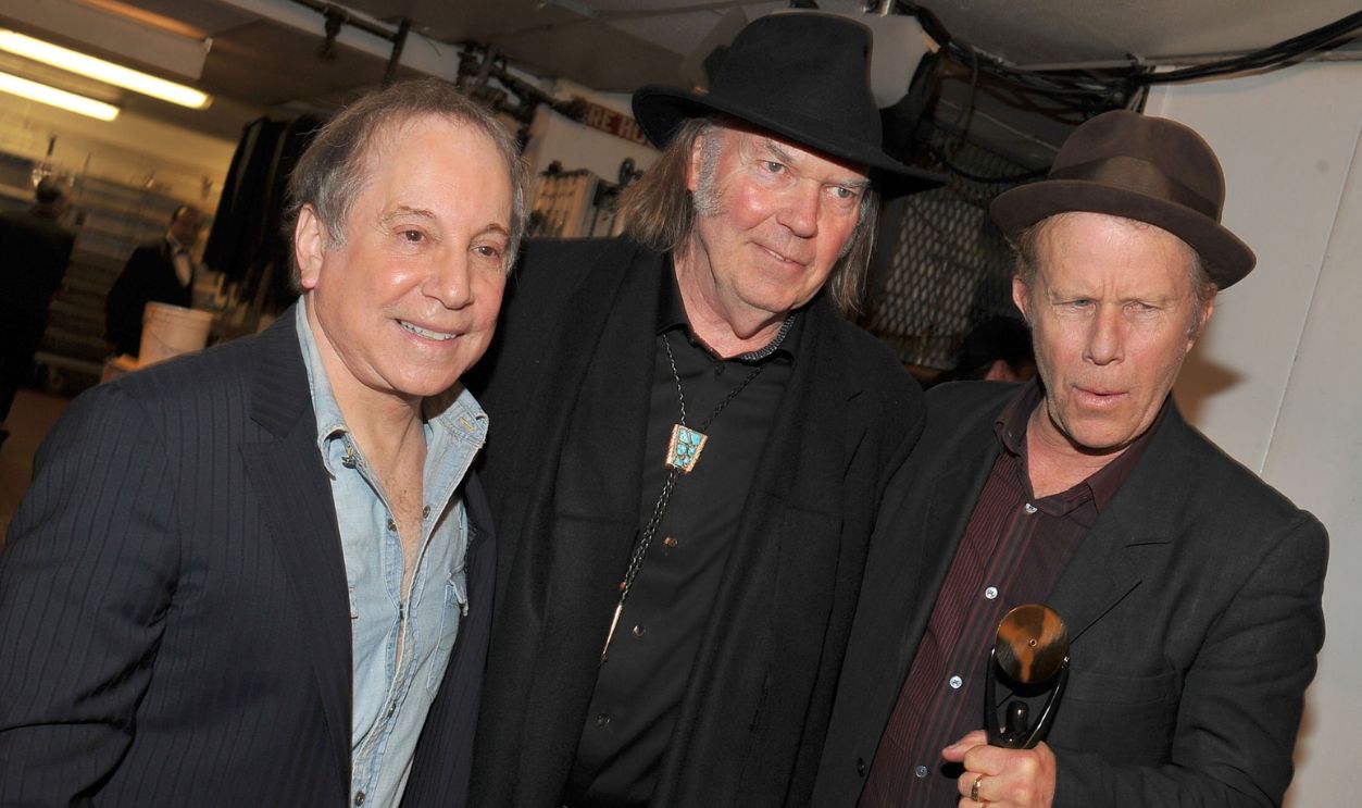 NEW YORK, NY - MARCH 14: (EXCLUSIVE COVERAGE) (L-R) Presenters Paul Simon and Neil Young with inductee Tom Waits pose backstage at the 26th annual Rock and Roll Hall of Fame Induction Ceremony at The Waldorf=Astoria on March 14, 2011 in New York City.