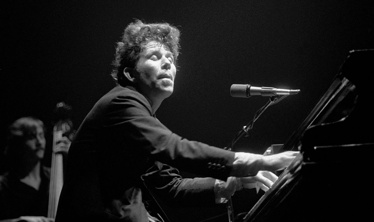 UNITED KINGDOM - MARCH 23: Photo of Tom WAITS; performing live onstage at the Victoria Apollo, playing piano