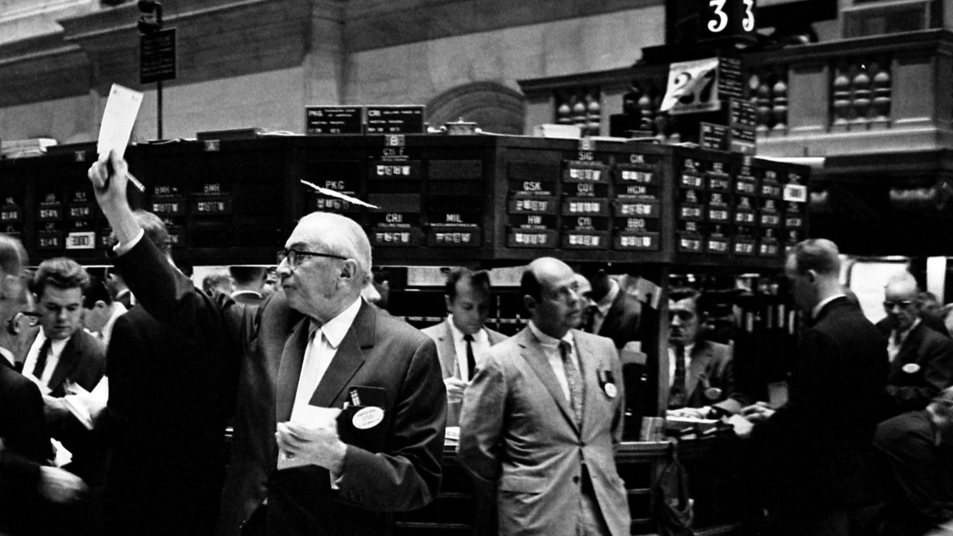Photograph shows stock brokers working at the New York Stock Exchange
