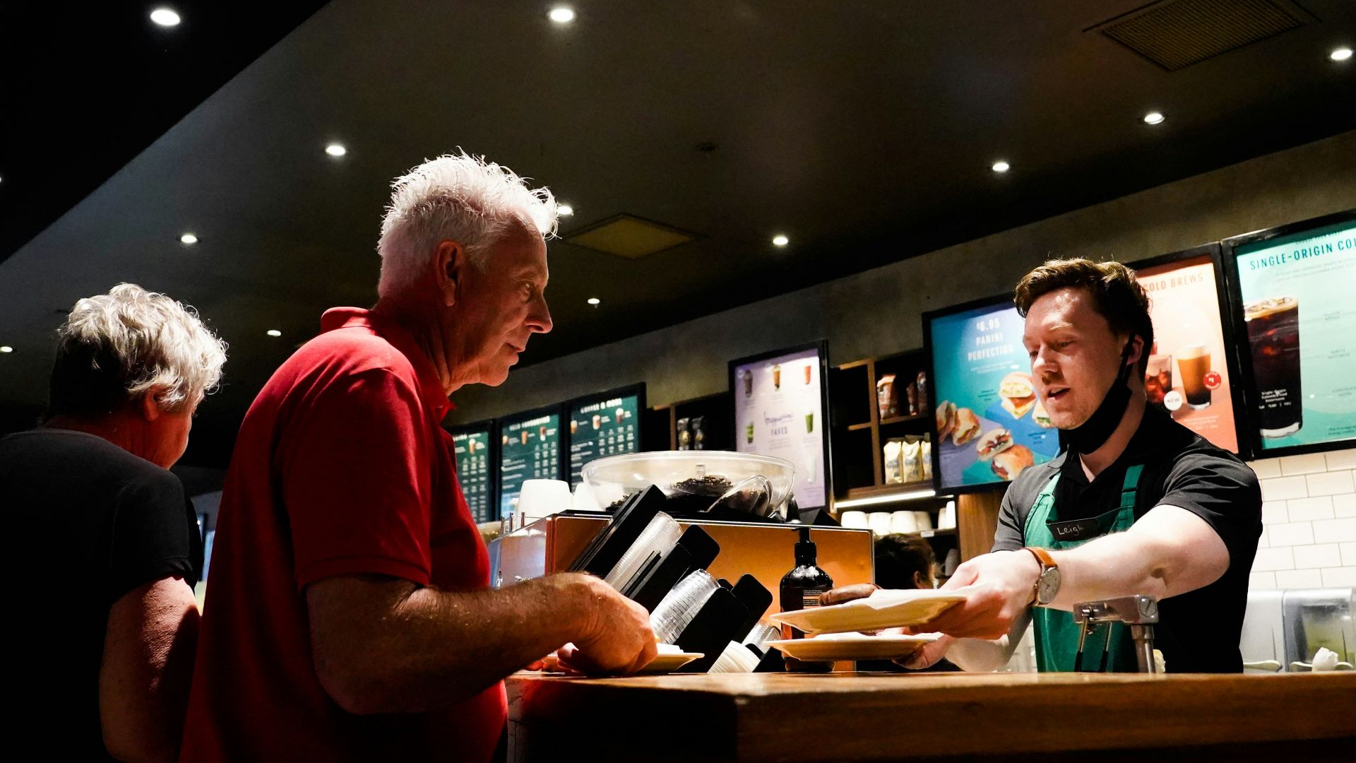a man ordering food at a fast food restaurant