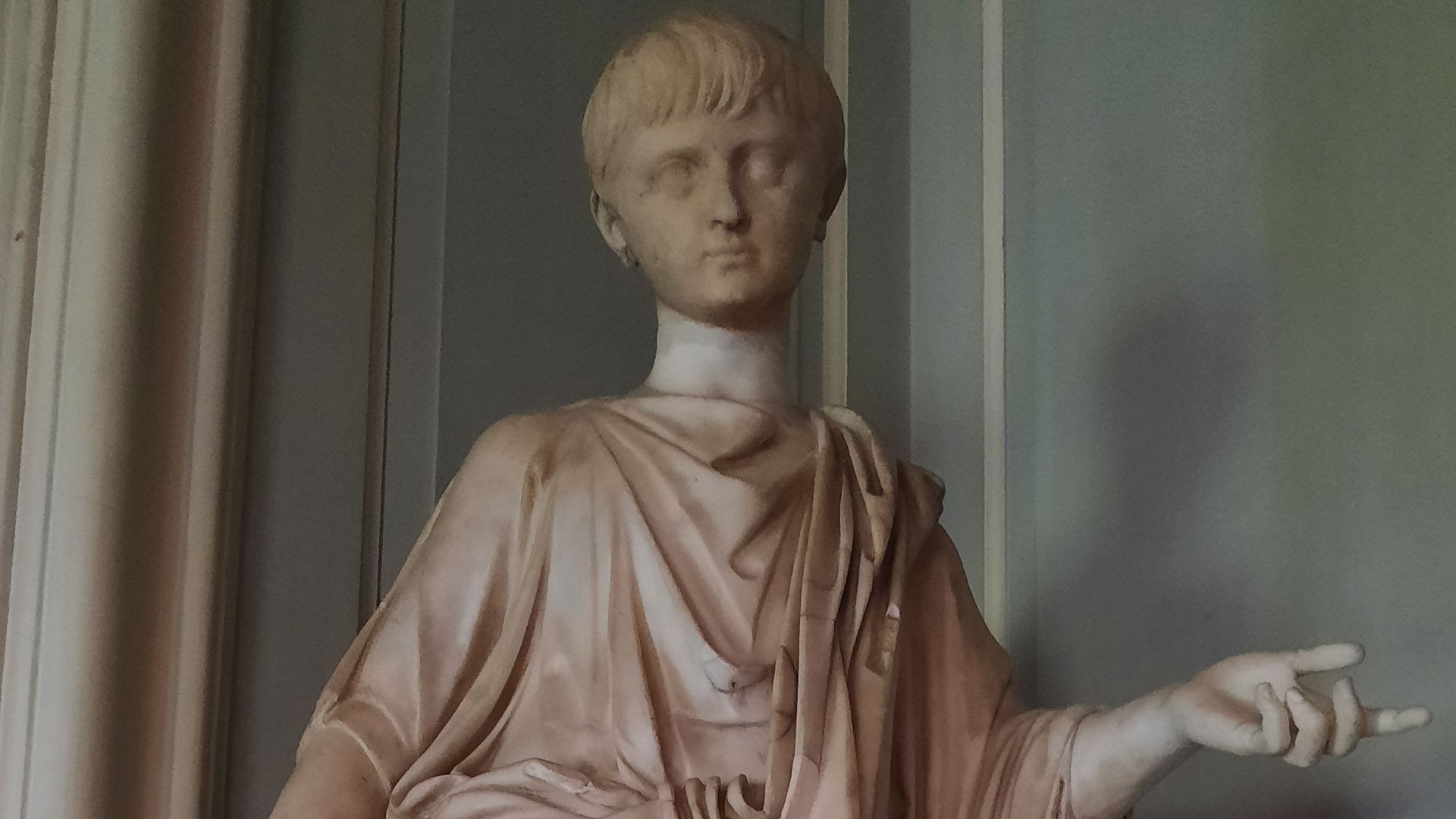 Carrara marble, Emperor Nero (37-68 AD) as a boy, Roman, c. AD 51-4, with modern restorations. A marble figure of the Emperor Nero as a boy, wearing a toga draped over a sleeved tunic, with the proper left hand raised, the index finger pointing. The figur