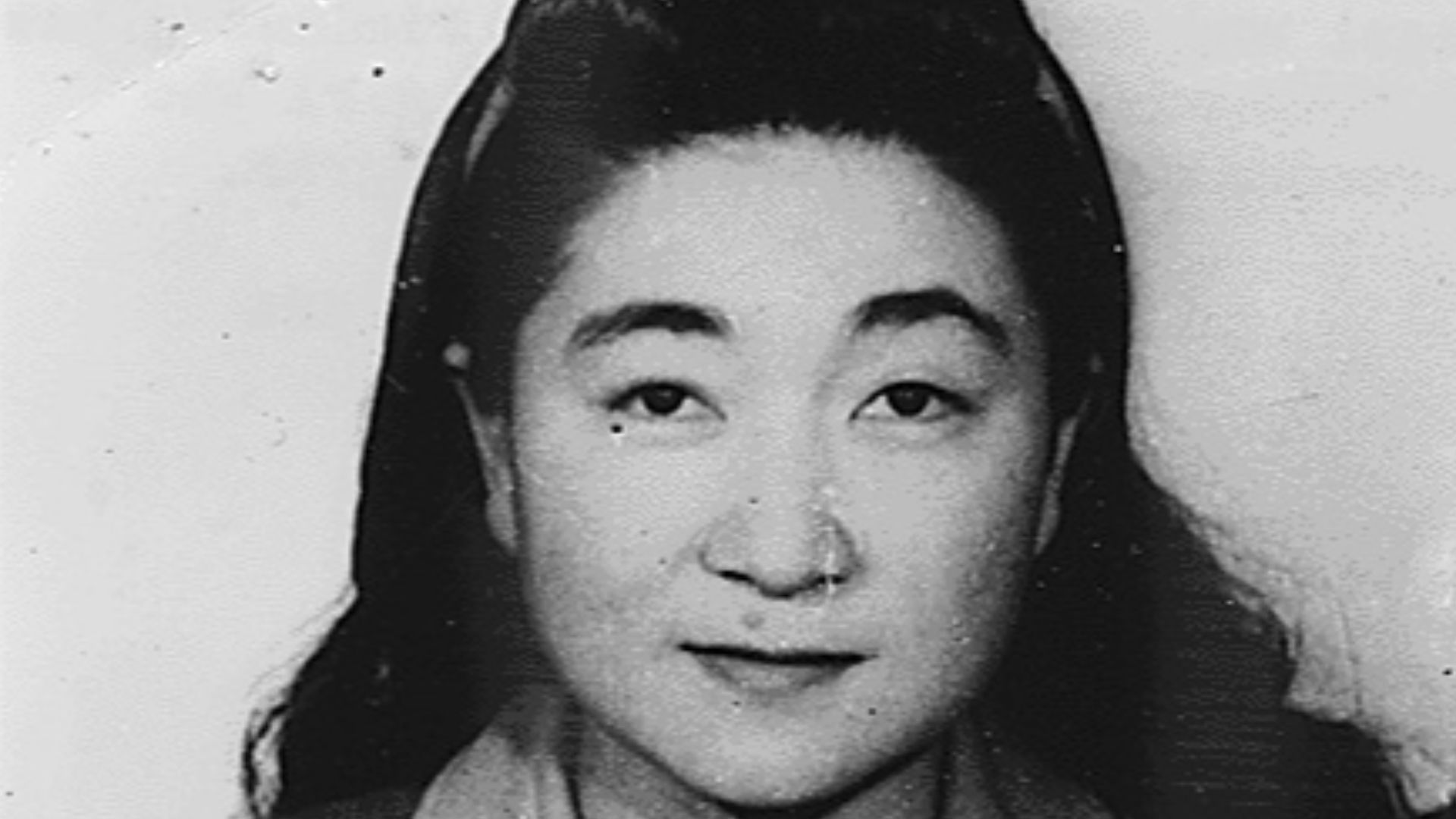 Photograph of Iva Toguri, mug shots taken at Sugamo Prison on March 7, 1946. Captions on the reverse of both photographs state