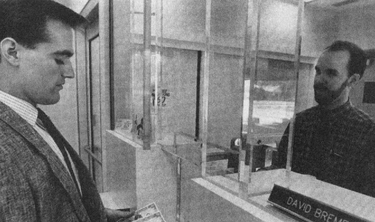 Bank teller at work. (1992)