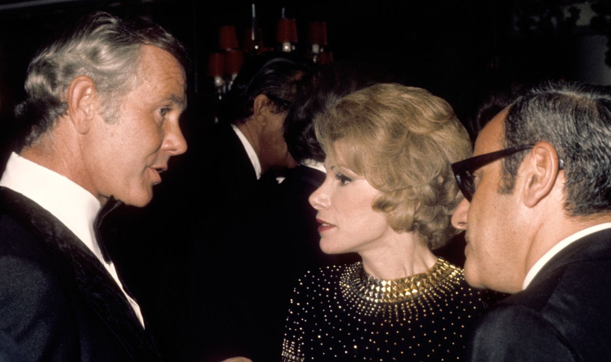Tonight Show host Johnny Carson greets comedienne Joan Rivers and her Husband Edgar Rosenberg at the party after taping the 10th anniversary show on September 30 1972 in Los Angeles, California.