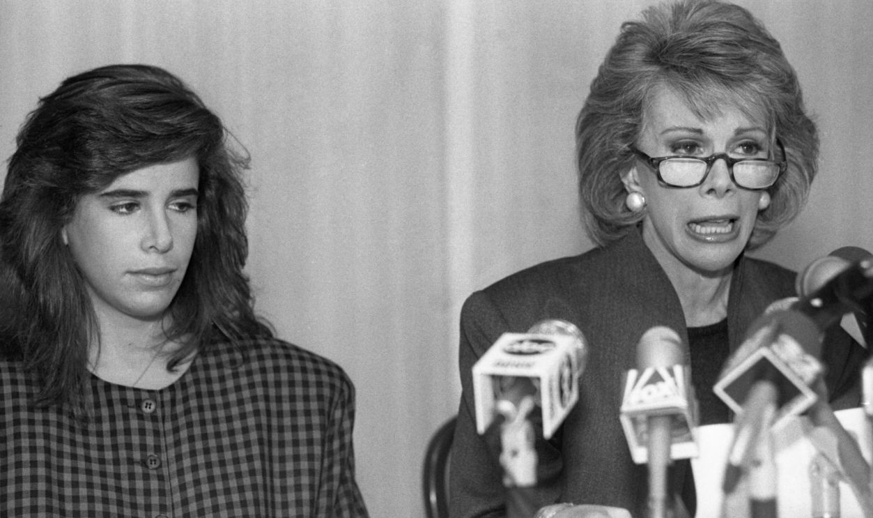 Comedian Joan Rivers, tearful and speaking in an emotion choked voice, tells reporters at a news conference that she will file a $50 million suit against Gentlemen's Quarterly magazine. Rivers also said she is demanding retractions of an article that presented a damning portrayal of her relationship with her late husband Edgar Rosenberg
