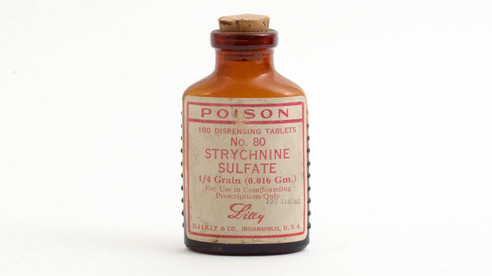 Bottle of Strychnine Sulfate tablets in a brown glass bottle with cork top closure. Strychnine is a highly toxic, colorless, crystalline alkaloid used today as a pesticide for rodents or birds. When inhaled, swallowed, or absorbed through the eyes or mout