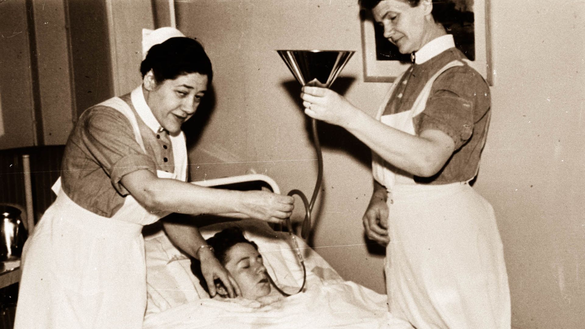 Insulin shock therapy performed by unnamed nurses on an unnamed patient. Source indicates that it was shot around the year 1930, however, as results of the procedure were first made public in 1933, and the practice wasn't widespread until a few years afte