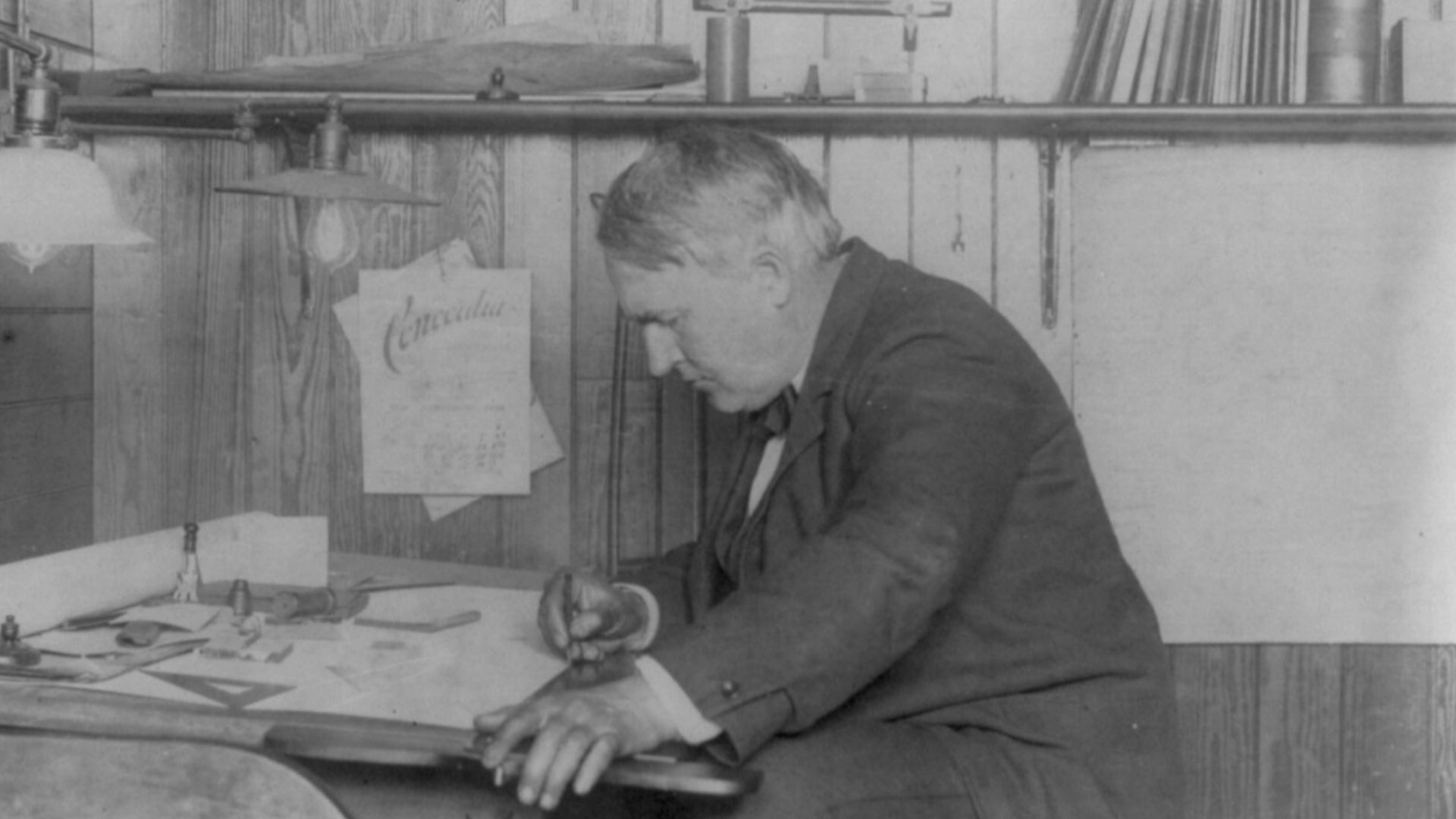 Title: Thomas Alva Edison, 1847-1931, left profile, seated at his desk, writing
Abstract/medium: 1 photographic print.