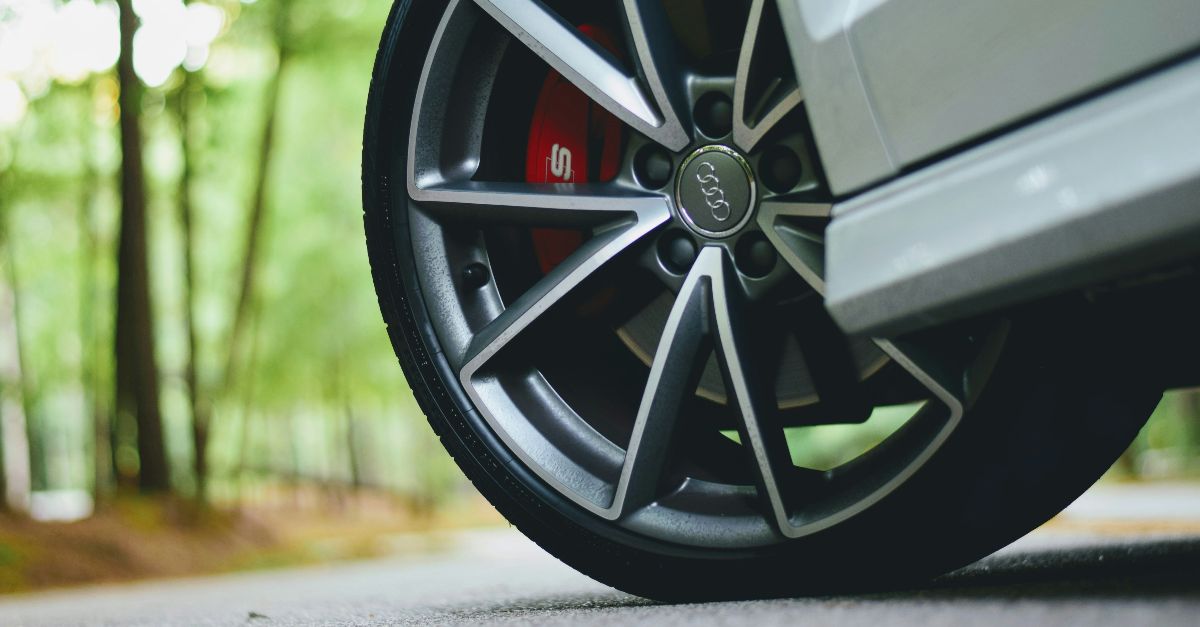 white Audi vehicle with gray wheels