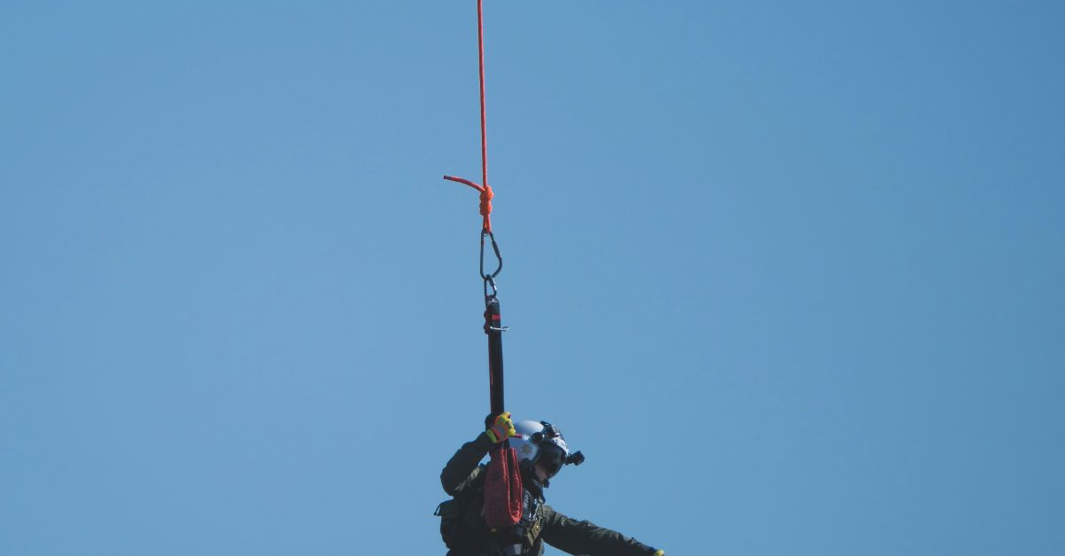 man in black jacket and pants jumping