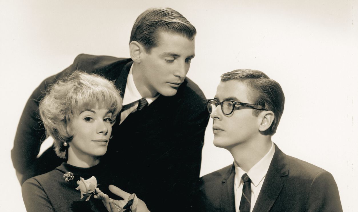 Folk trio Jim, Jake & Joan (L-R Joan Rivers, Jake Holmes and Jim Connell) pose for a portrait circa 1965 in New York City, New York.