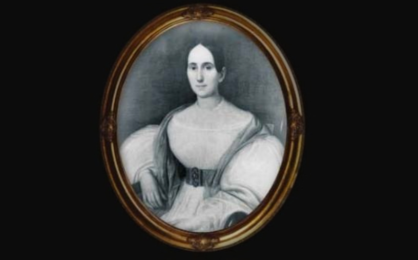 Madame LaLaurie in white dress and a vest