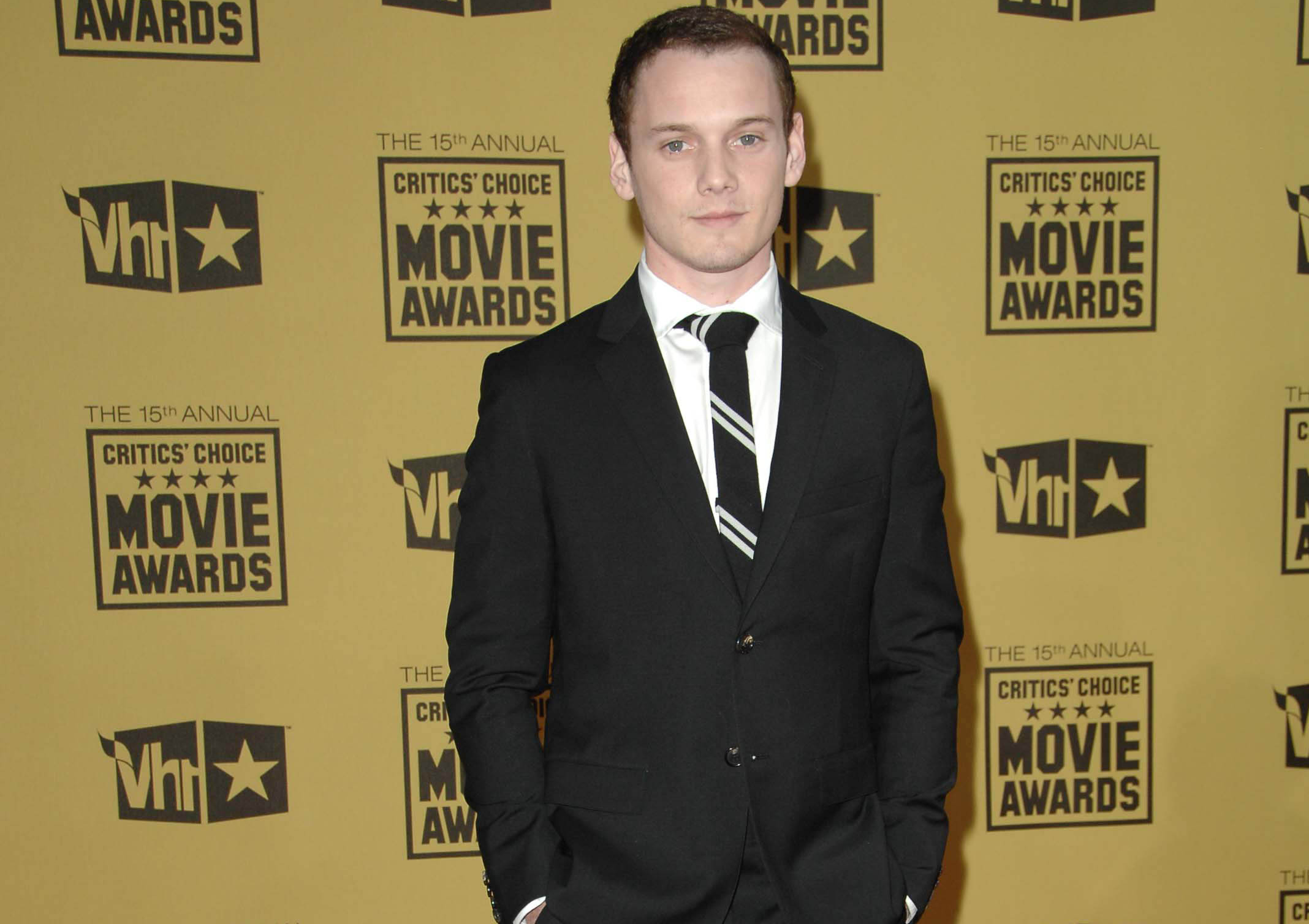 Anton Yelchin at event in black suit and tie