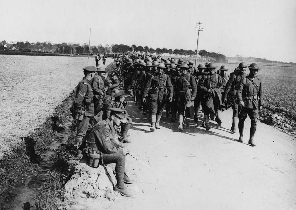 Columns of American troops marching along a road