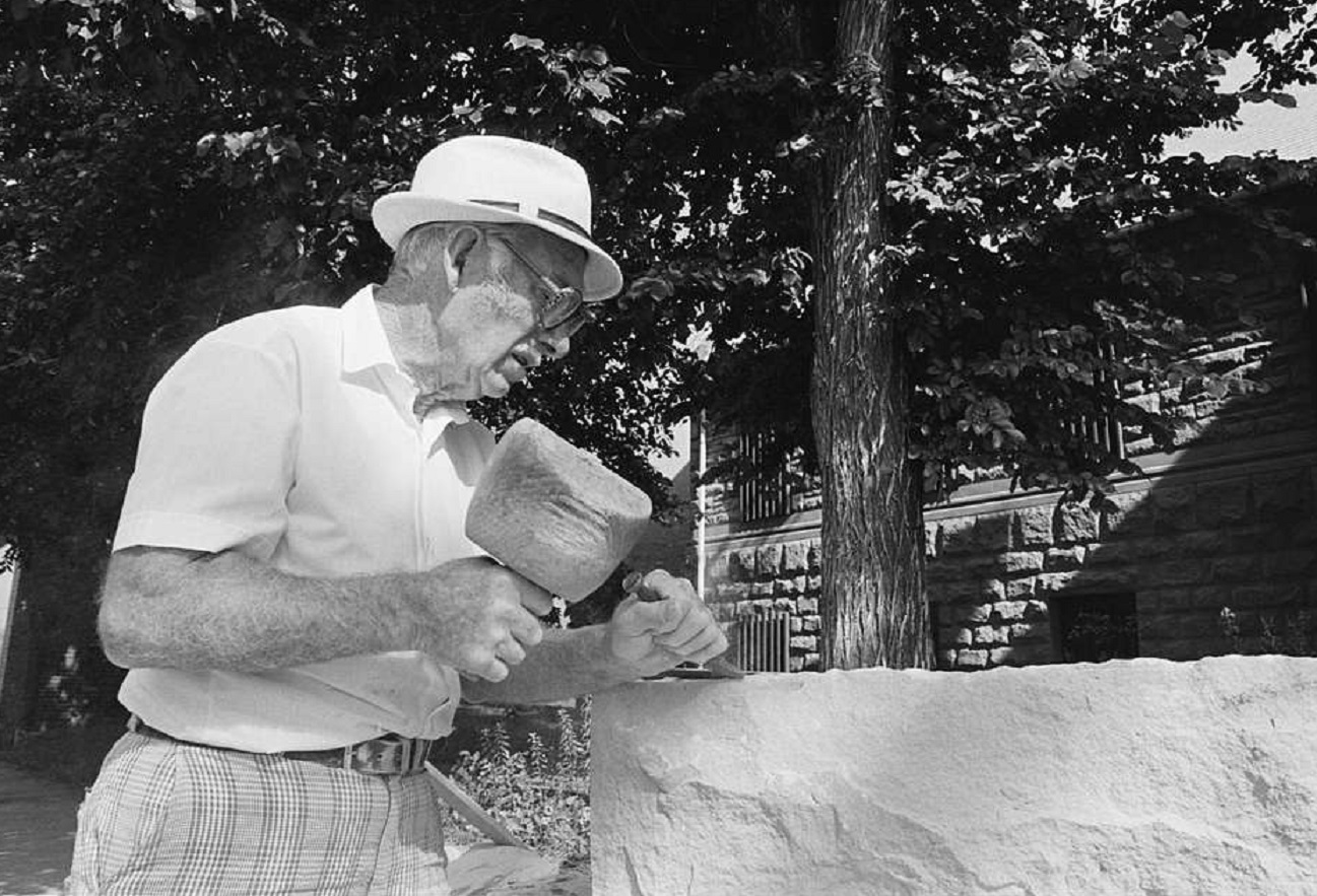Stonecutter working on a stone - 1979