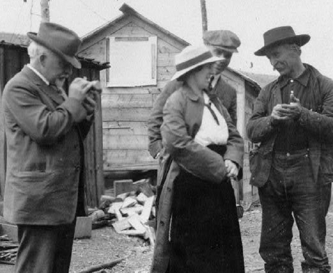 Woman And Three Men are Talking Outside - 1900