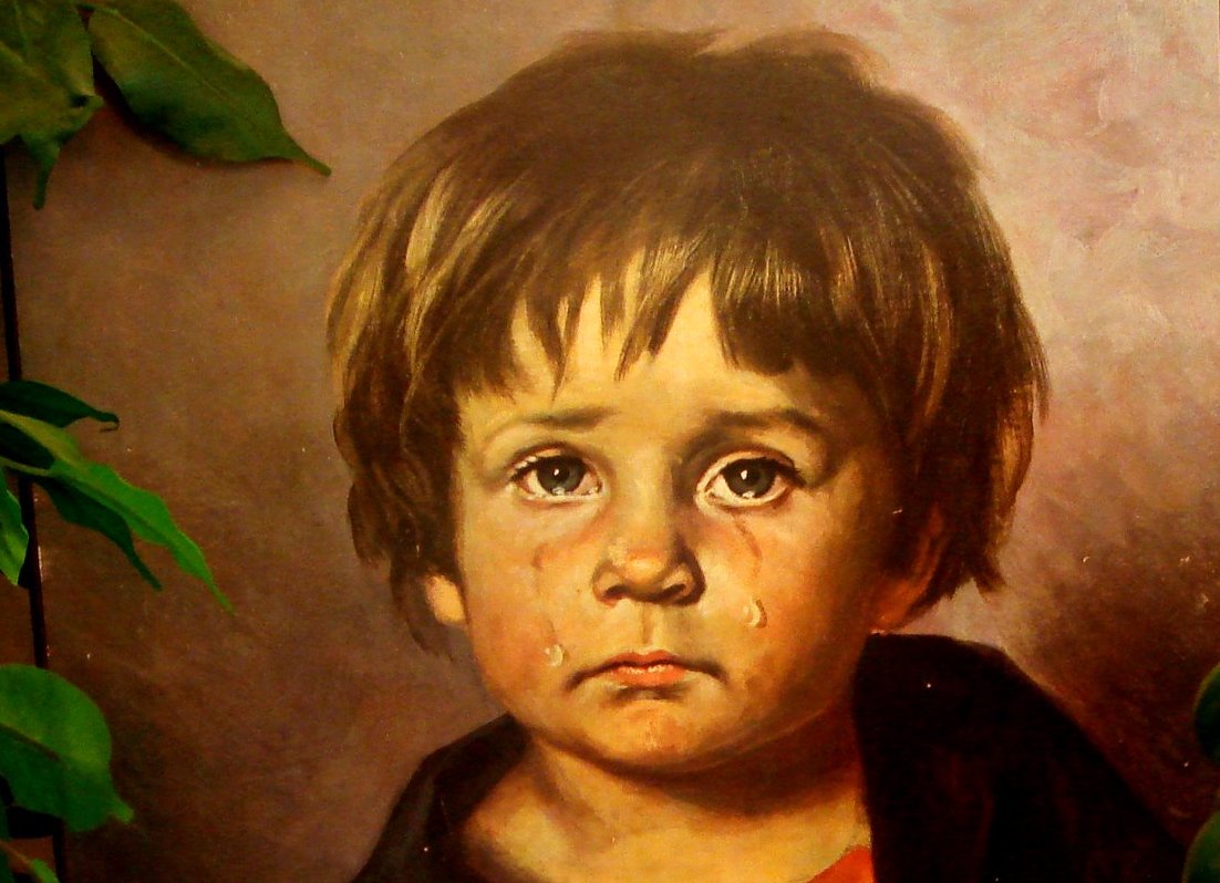 Close-up Photo of a painting depicting a crying boy