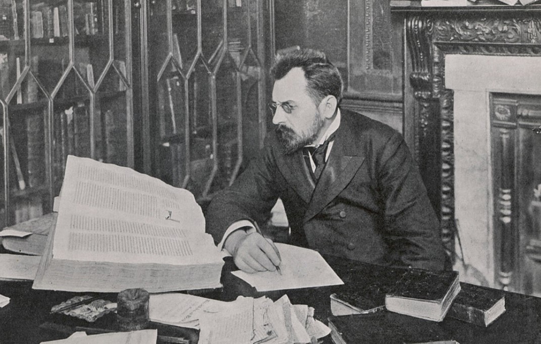 Mr. Voynich at table with books