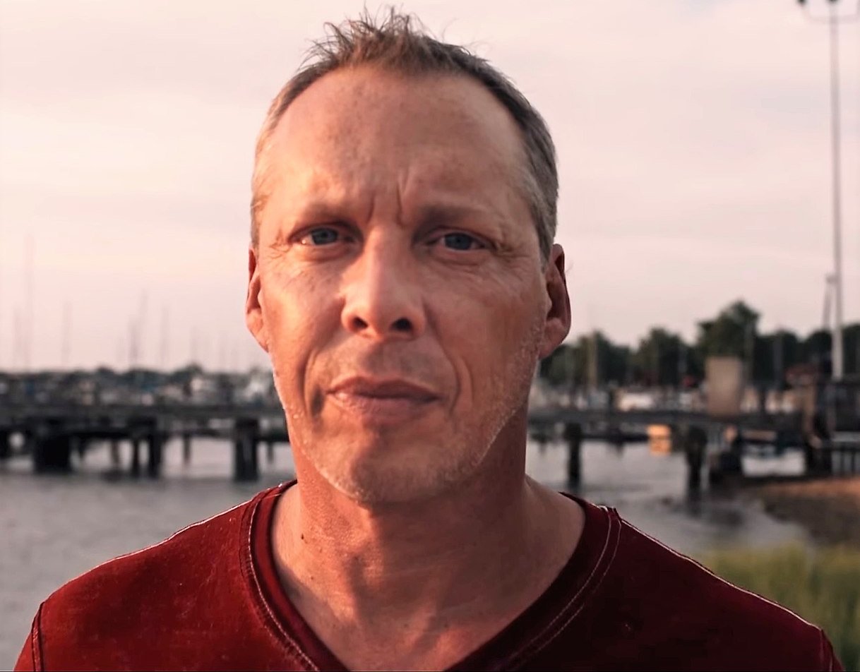 Portrait Photo of Derek Amato in a red shirt