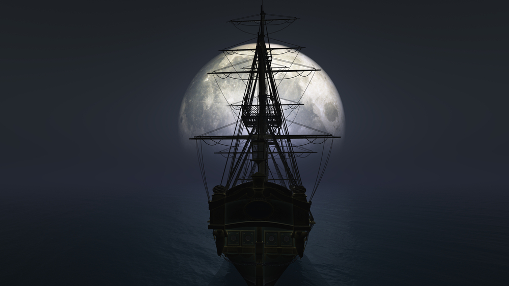 old ship at sea on full moon