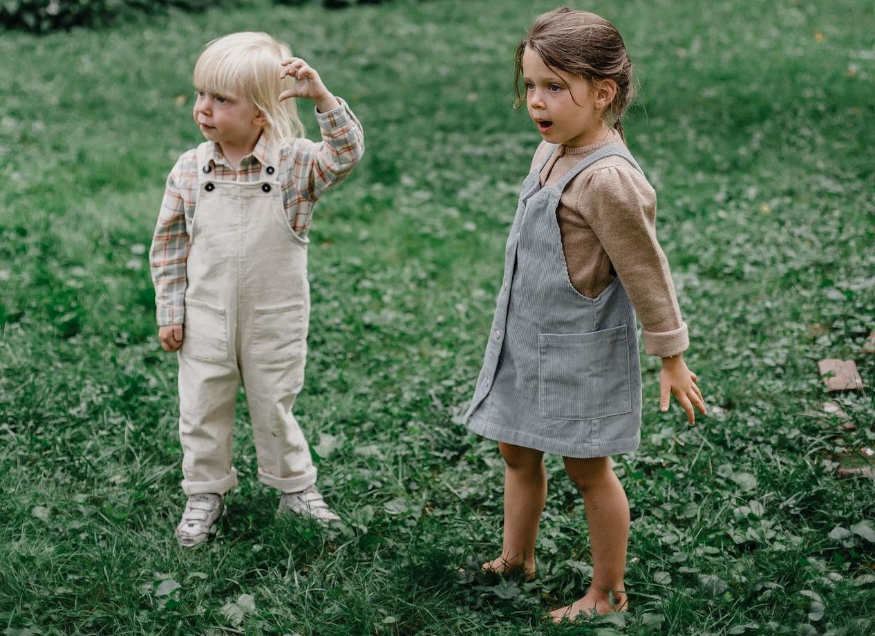 Funny children on green lawn