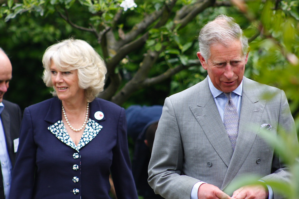 Portrait Photo of Prince Charles & Camilla standing next to each other
