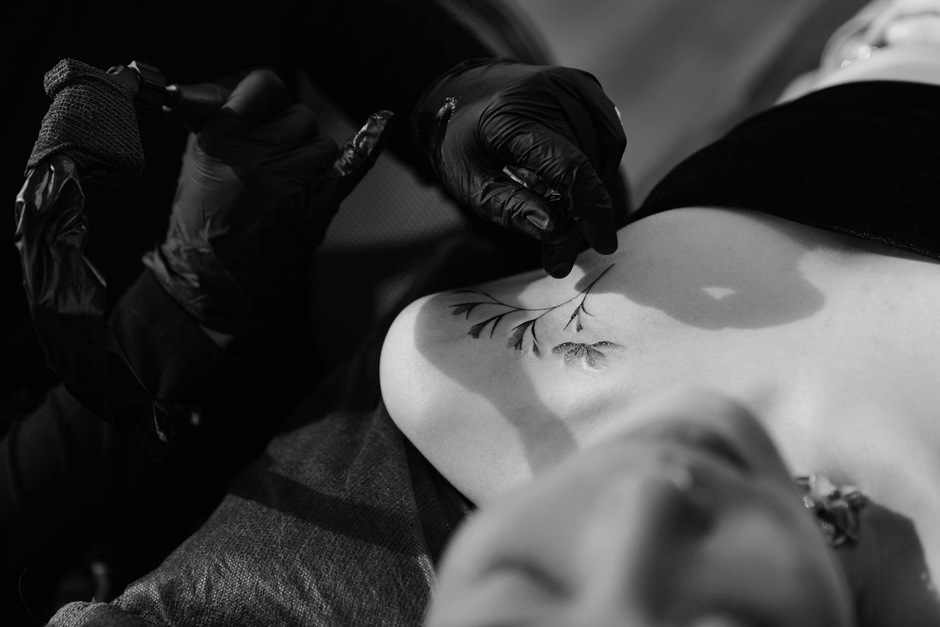 Woman tattooing