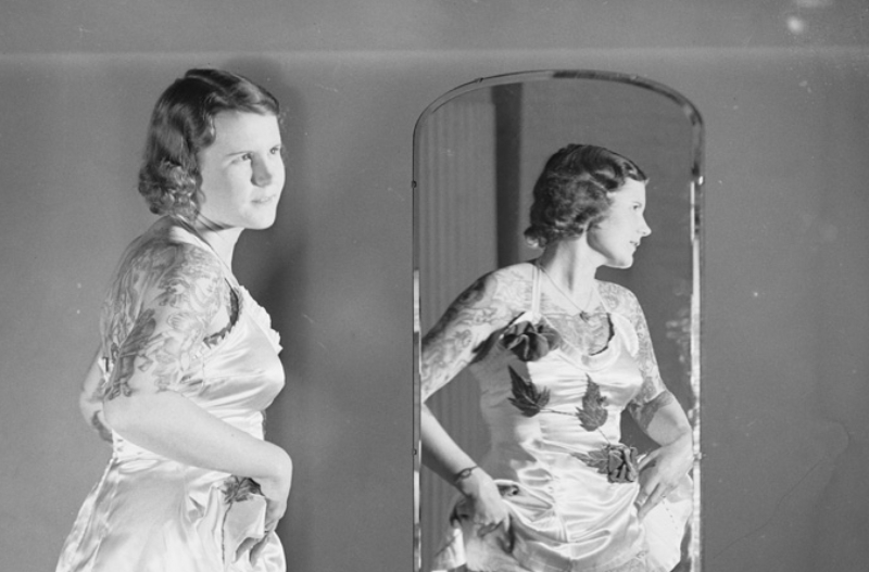 Betty Broadbent looking at a mirror